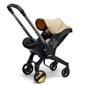 Siège-auto-poussette de bébé à 15 mois Doona i Sahara sand