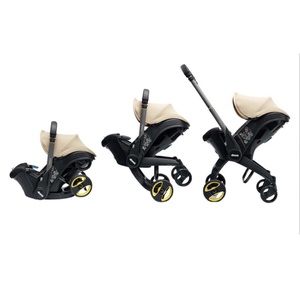 Siège-auto-poussette de bébé à 15 mois Doona Sahara sand