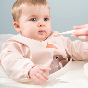 Sleeved pocket bib Playground Done by deer Powder